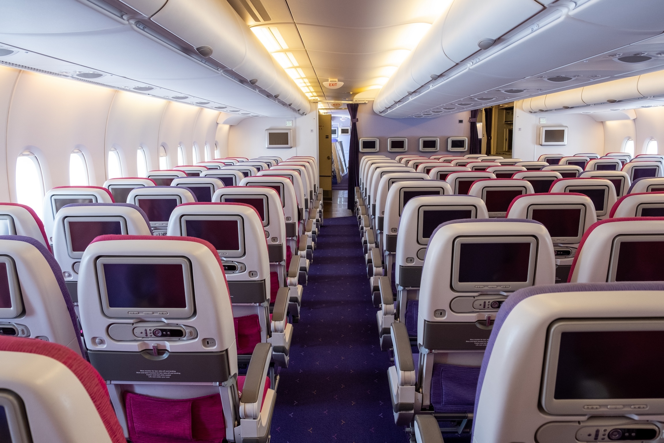 Airplane economy class seat of aircraft cabin interior when fly