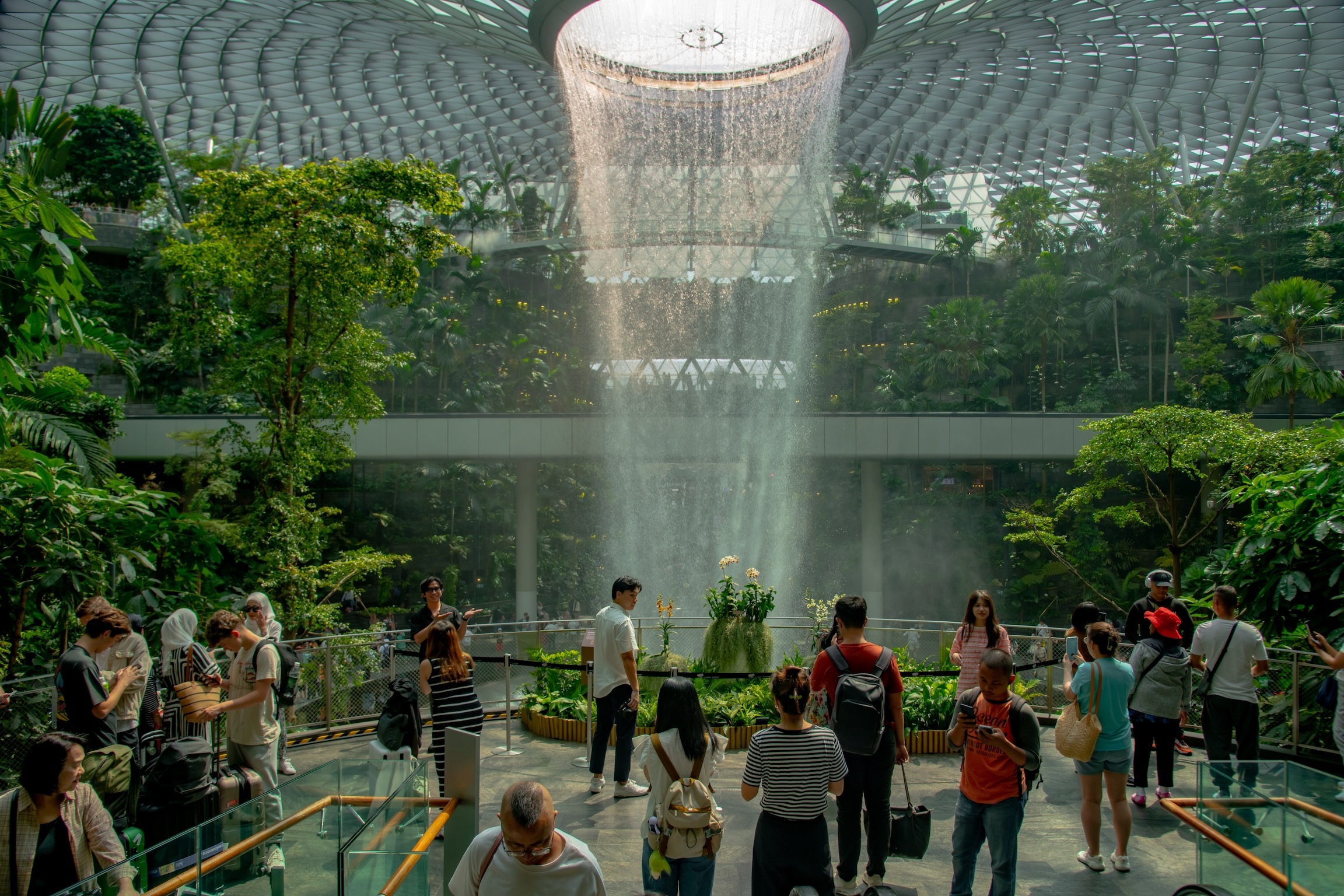 Changi Airport, Singapore - July 30th 2024: World Largest Indoor Water Falls in Jewel Changi Airport - Singapore. Best Airport in the World. waterfall in rain forest Jewel Changi Airport Singapore.