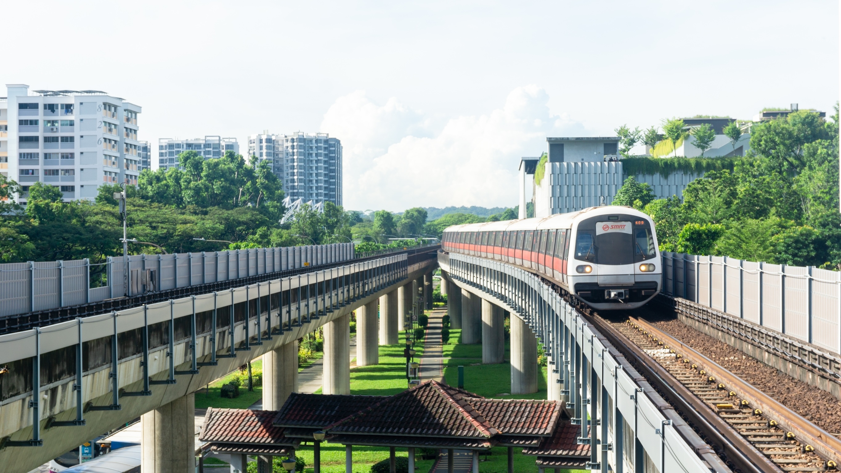 Singapore, 2 November 2024: A modern MRT train approaching a bustling station in Singapore, showcasing efficient public transportation, urban mobility, and sustainable city infrastructure