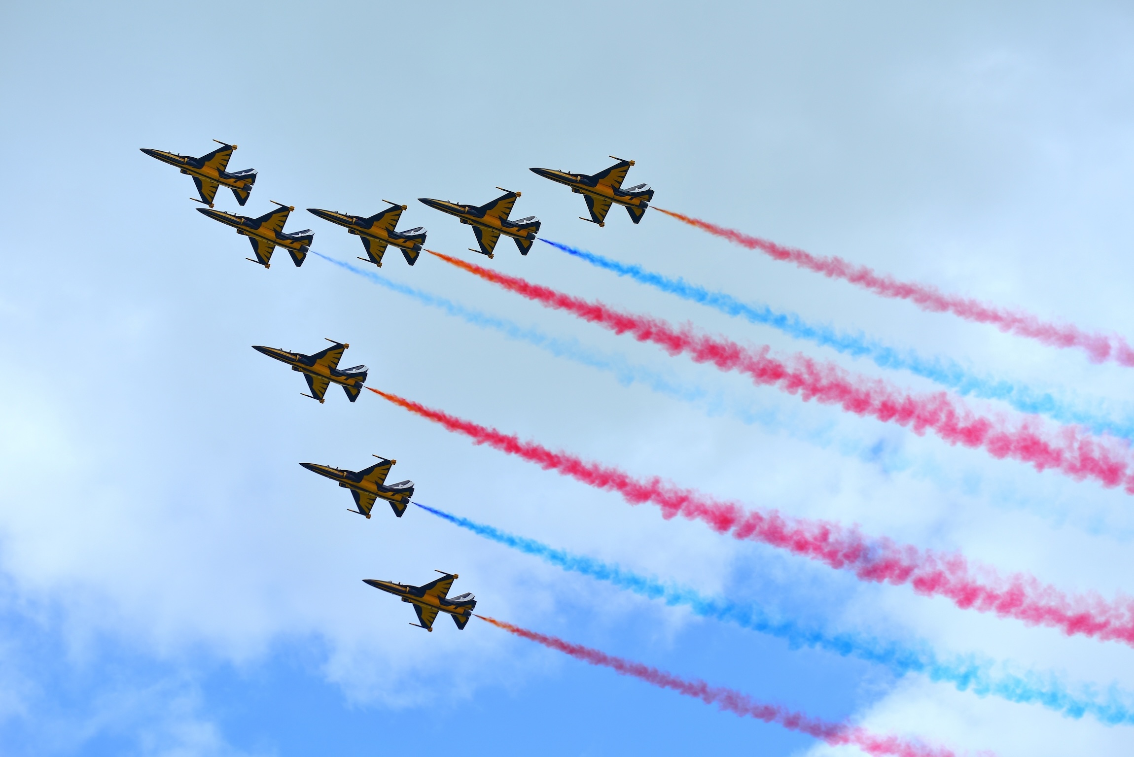 SINGAPORE - FEBRUARY 16:  RKAF Black Eagles Aerobatic Team aerobatic performance at Singapore Airshow February 16, 2016 in Singapore