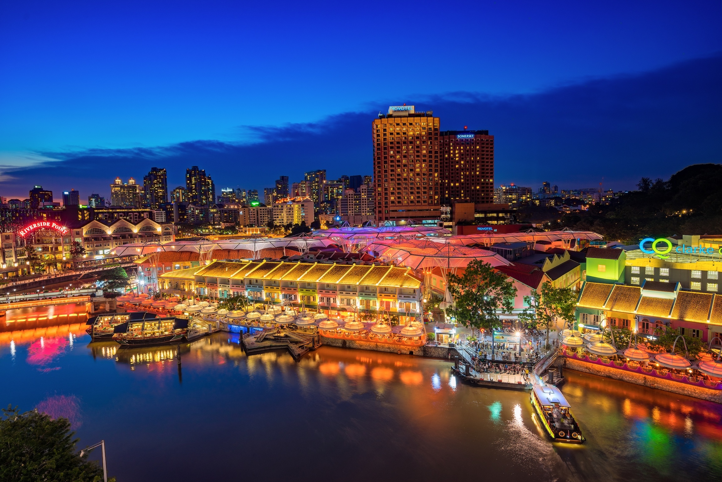 Singapore, Singapore - September 18, 2016 : Colorful light building at night in Clarke Quay, Singapore. It is a historical riverside quay in Singapore, located within the Singapore River Area.
