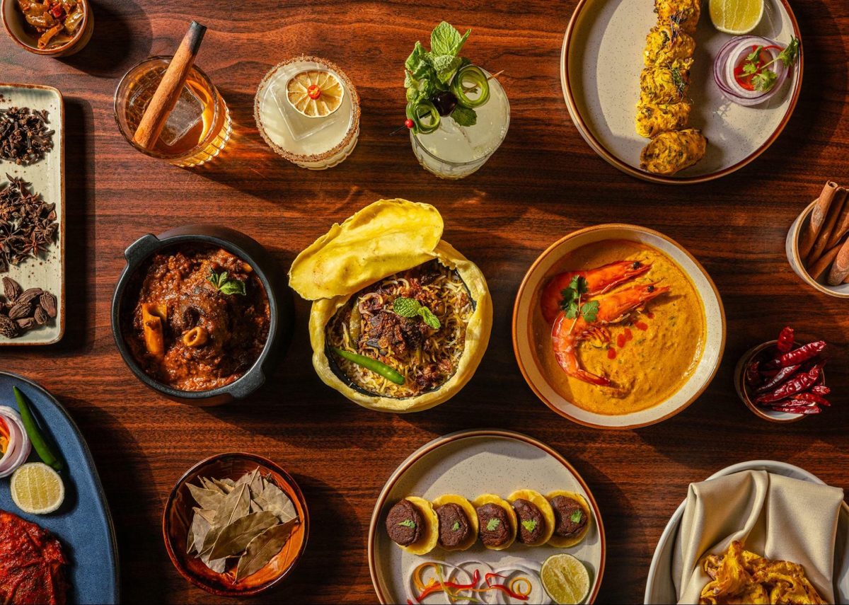 Different Indian dishes laid on a table