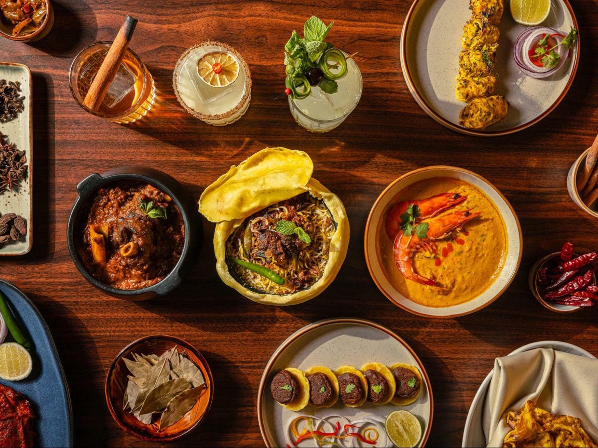 Different Indian dishes laid on a table